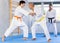 Young and elderly men training judo fight