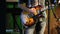 Young electric guitarist player playing guitar, closeup