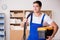 The young electrician with cable working in office