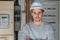 Young electrician posing arms crossed at workplace