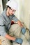 Young electrician using pliers