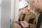 Young electricians wiring wall sockets