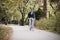 Young elegant businessman traveling to work by bicycle