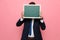 Young elegant man in suit hiding behind blackboard