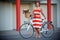 Young elegantly dressed woman with bicycle and a