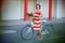 Young elegantly dressed woman with bicycle and a