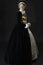 A young Elizabethan woman in a black velvet dress
