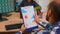 Young employee checking clipboard information