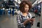 Young employee presses the buttons of a mobile phone