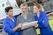 Young engineer apprentices learning to repair part airplane