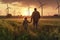 Young engineer caring for his daughter and looking at windmill field at sunset, concept of renewable energy, love, nature, family