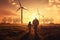 Young engineer caring for his daughter and looking at windmill field at sunset, concept of renewable energy, love, nature, family