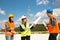 Young engineers and workers having a meeting at wind farm