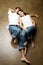 young ethnic couple relaxing on the floor