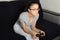 Young european dark-haired teen girl plays video games