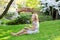 Young European woman eating sushi in Japanese park