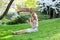 Young European woman eating sushi in Japanese park