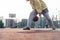 Young European woman plays basketball on the sports field, bouncing the ball, no face visible copy space