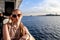 A young European woman rides a steamboat on the Dnieper river against the background of the Kherson port Ukraine. Tourist walk