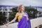 Young european woman with short hair in purple traditional saree. Outdoor portrait. India, Bangalore