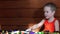 Young excited boy play table soccer and laughing in sunny day