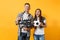 Young excited couple woman man football fans cheer up support team with soccer ball, film making clapperboard isolated