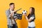 Young excited couple woman man football fans cheer up support team with soccer ball, film making clapperboard isolated