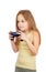 Young excited cute girl with grey blue eyes and long light brown hair plays computer game with joystick
