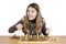 Young Excited Girl Looking At The Camera With Large Smile And Eyes Full Of Joy With Both Clenched Fists During The Chess Match