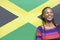 Young excited woman against Jamaican flag