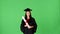 Young excited woman graduate in gown with diploma