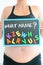 Young expectant mother with letter blocks spelling name on her pregnant belly