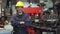 Young factory worker or engineer close up portrait in factory