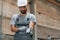 Young factory worker in grey uniform