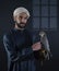 Young falconer holding a bird of prey.