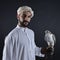 Young falconer holding a bird of prey.