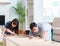 Young family assembling furniture at new house