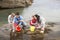 Young family at beach collecting shells