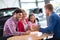 Young family in car dealership