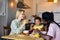 Young Family with child having breakfast at home. Happy lifestyle family moments.