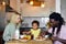 Young Family with child having breakfast at home. Happy lifestyle family moments.