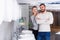 Young family couple choosing bathroom sink in store