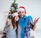 Young family decorating christmas tree on happy occasion