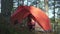 Young family of mother and daughter having happy vacation in camping in autumn.