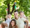 Young family playing windmills with children