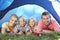 Young family poses in tent