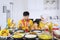 Young family praying before breaking fast