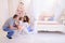 Young family preparing for upcoming in spacious bedroom light on