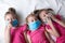 Young family in quarantine. Young children in protective medical masks. Epidemics, Covid-19 pandemic and influenza