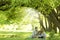 Young family reading the Bible in nature